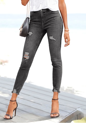 Destroyed-Jeans, mit ausgefranstem Beinabschluss und Stretchanteil, schmale Passform