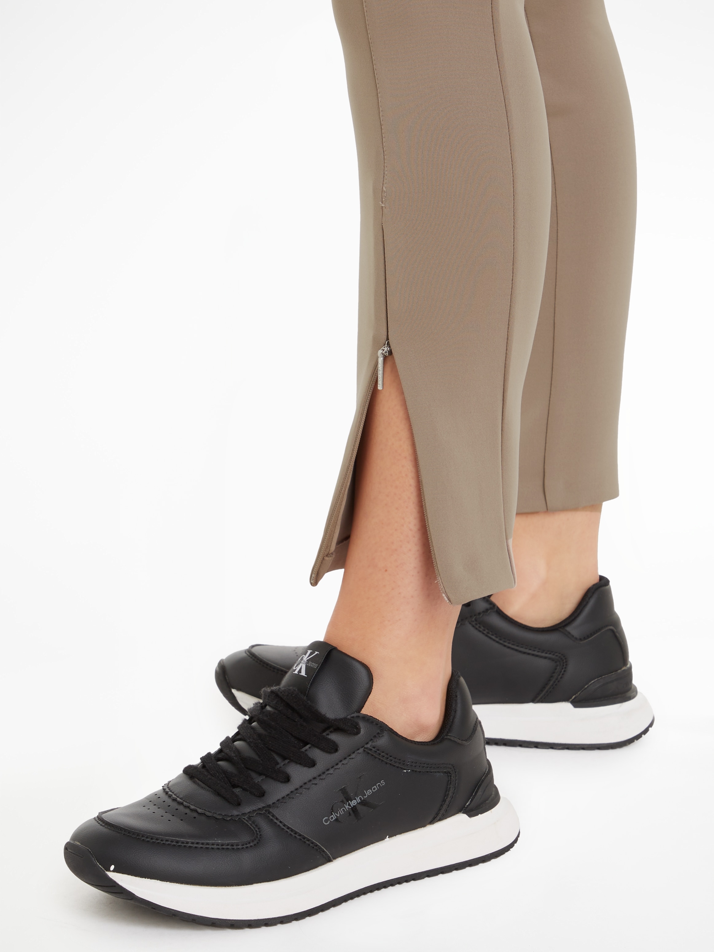 Calvin Klein Leggings »TECHNICAL KNIT LEGGING«, mit Reißverschluss am  Beinabschluss online bei OTTO