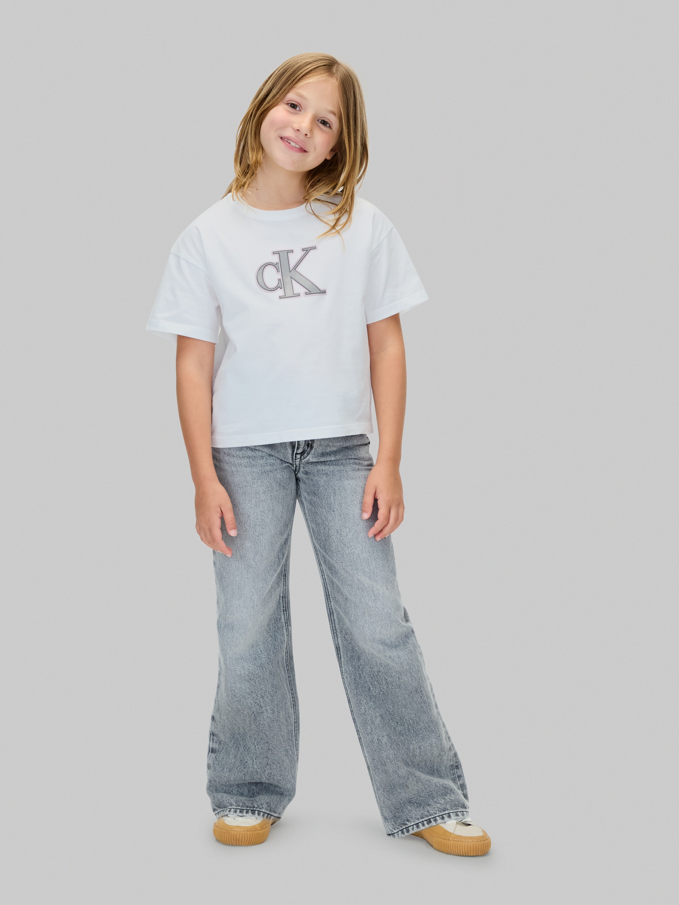Calvin Klein Jeans T-Shirt »FESTIVE GRAPHIC SS T-SHIRT«, für Kinder bis 16 Jahre, Glitzer-Druck