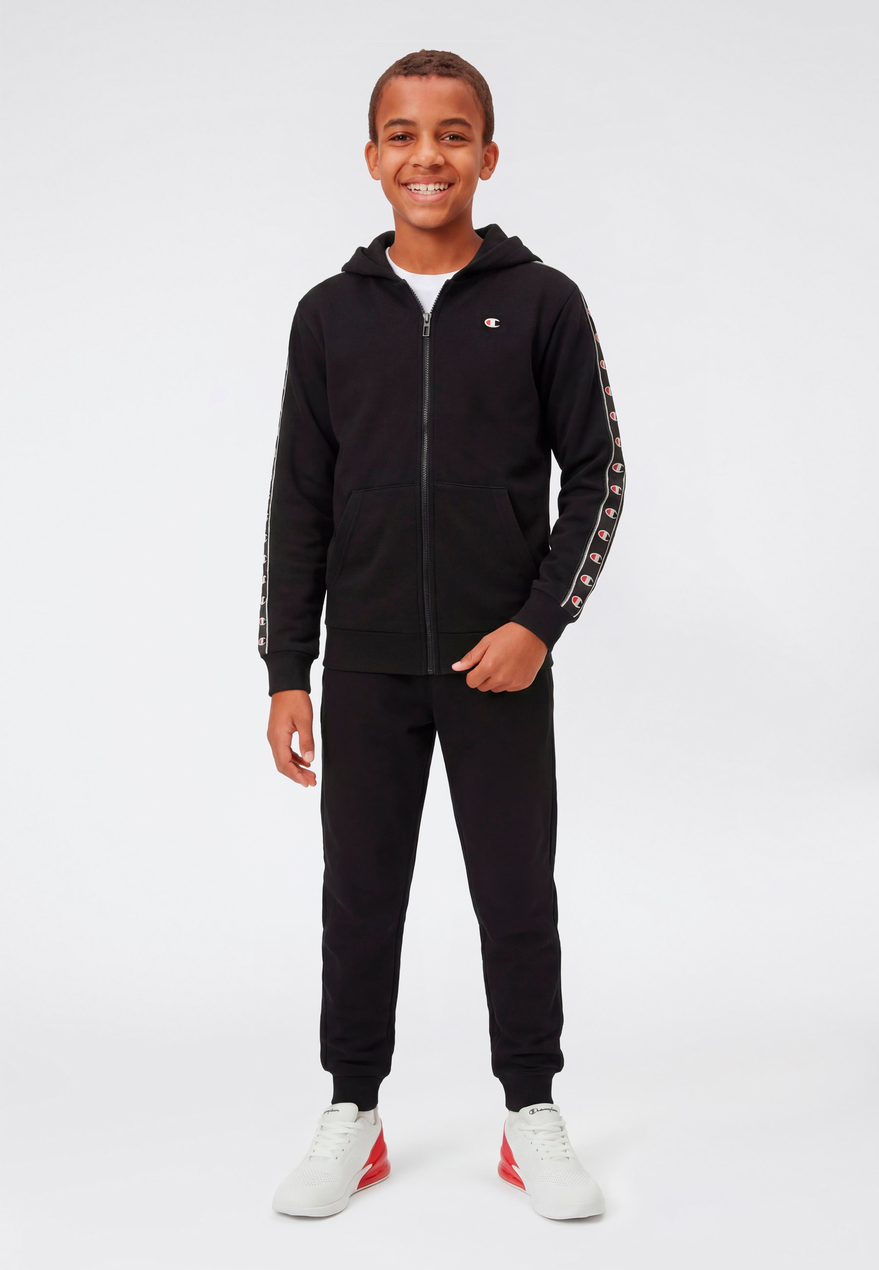 Champion Jogginganzug »Sport inspired Hooded Full Zip sweatsuit« 2 tlg. für Kinder, mit Kapuze, mit durchgehendem Reißverschluss