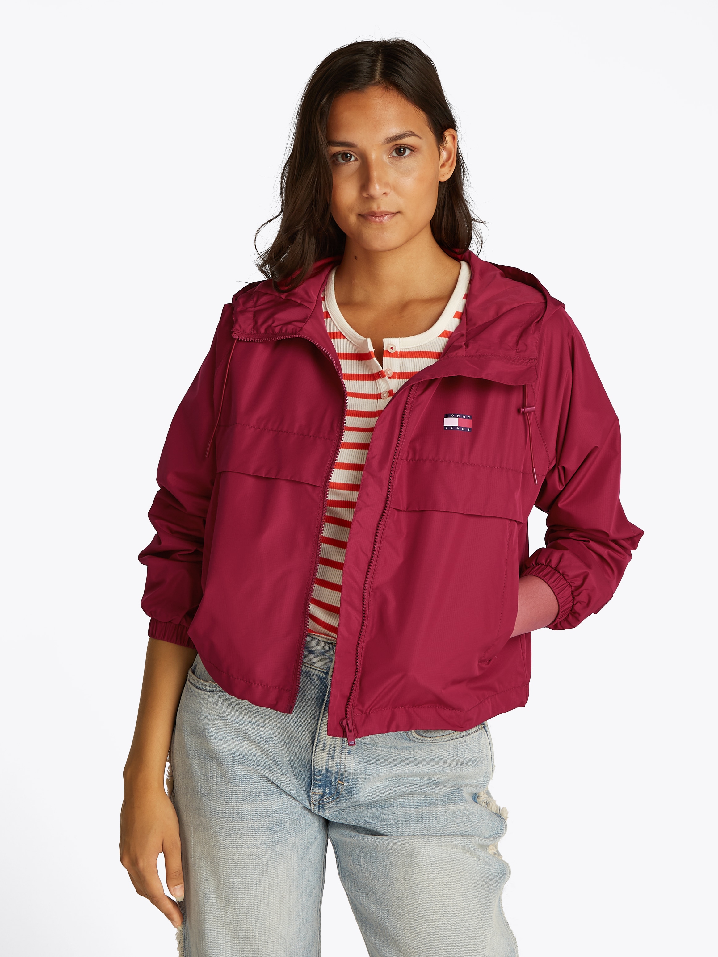 Tommy Jeans Damen Windbreaker »TJW ESSENTIAL WINDBREAKER EXT« mit Kapuze mit Logodruck, Größe M (38)