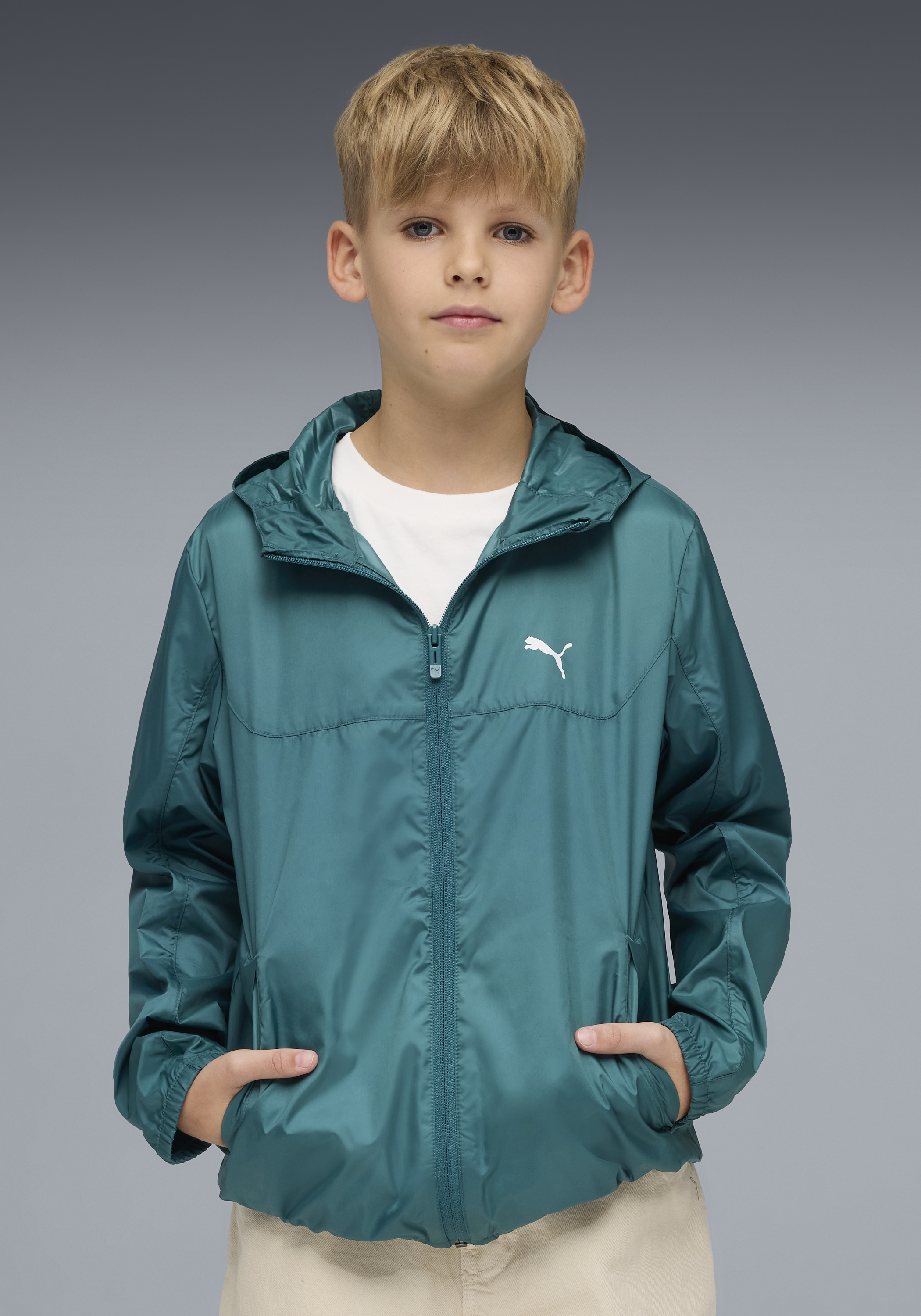 PUMA Windbreaker »ESS REGULAR WINDBREAKER« mit Kapuze für Jugendliche, mit Kapuze, mit Eingrifftasche