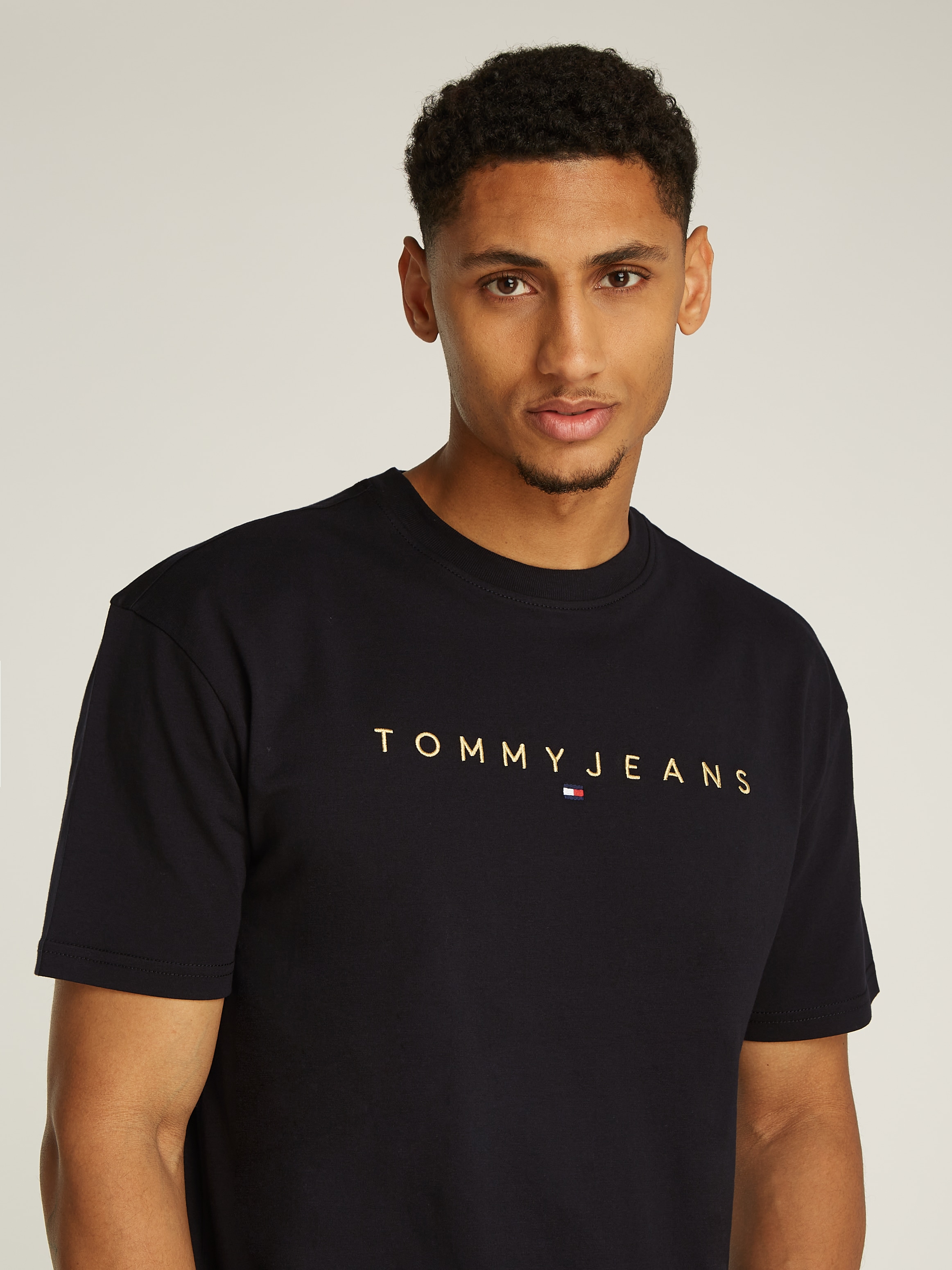 Tommy Jeans T-Shirt »TJM REG GOLD LINEAR LOGO TEE EXT«