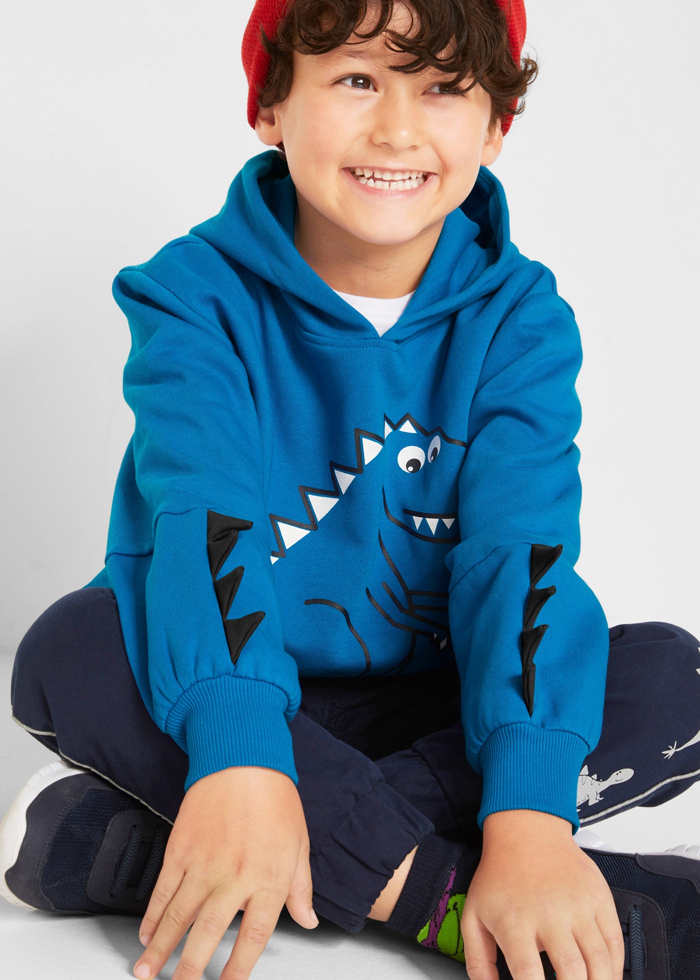 bonprix Hoodie , mit coolem Dino-Print, mit Applikation an den Ärmeln
