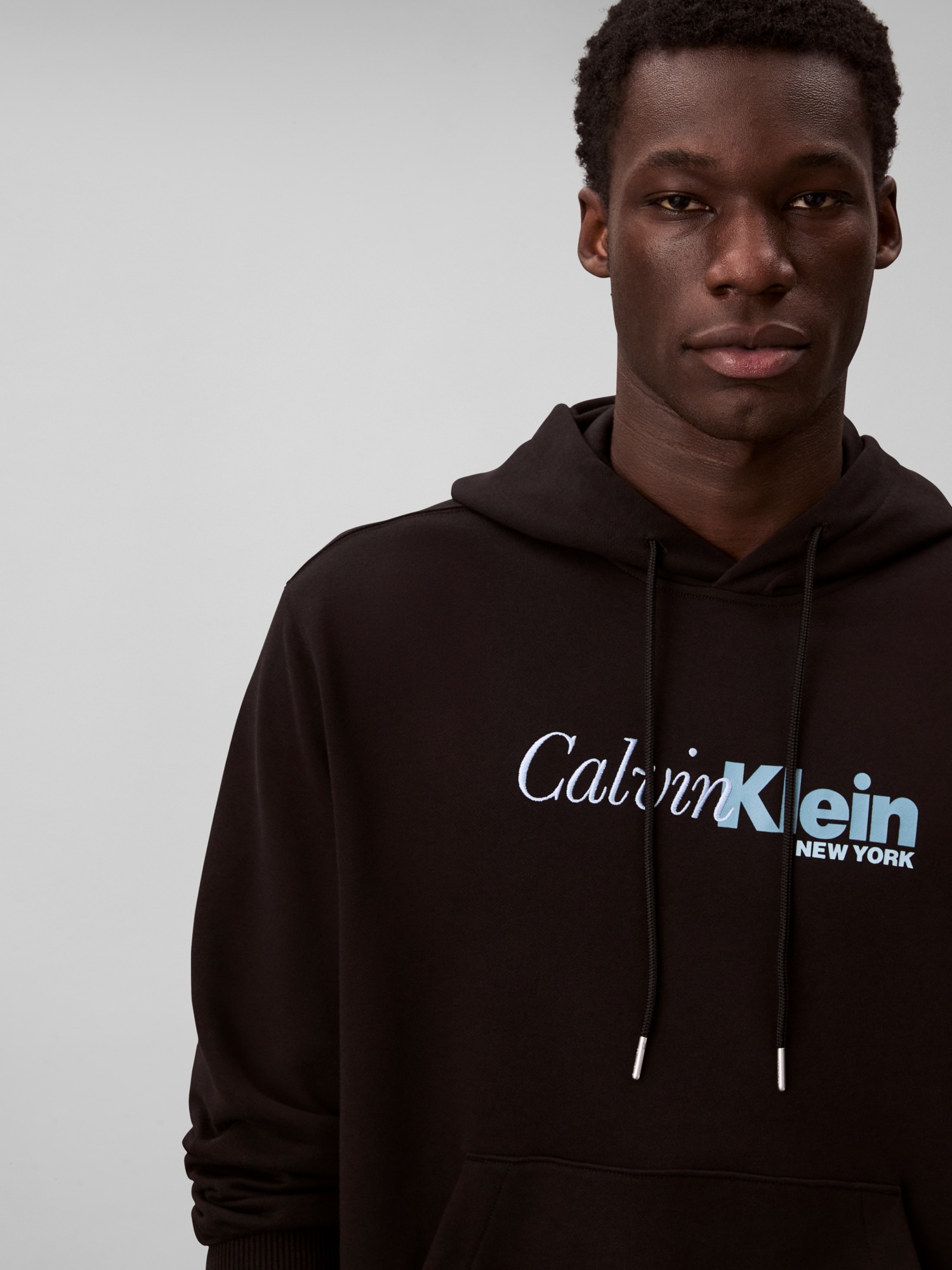 Calvin Klein Kapuzensweatshirt »LS EU 350TERRY CURSIVE GRAPHIC H«, regular fit, Logo-Schriftzug