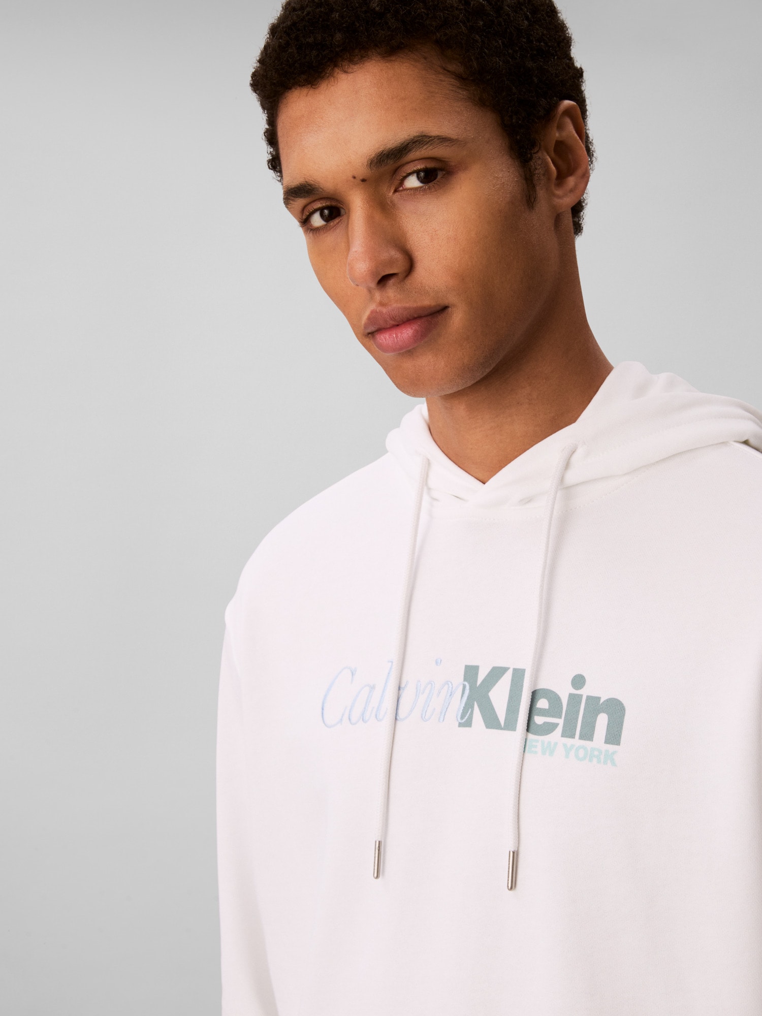 Calvin Klein Kapuzensweatshirt »LS EU 350TERRY CURSIVE GRAPHIC H«, regular fit, Logo-Schriftzug
