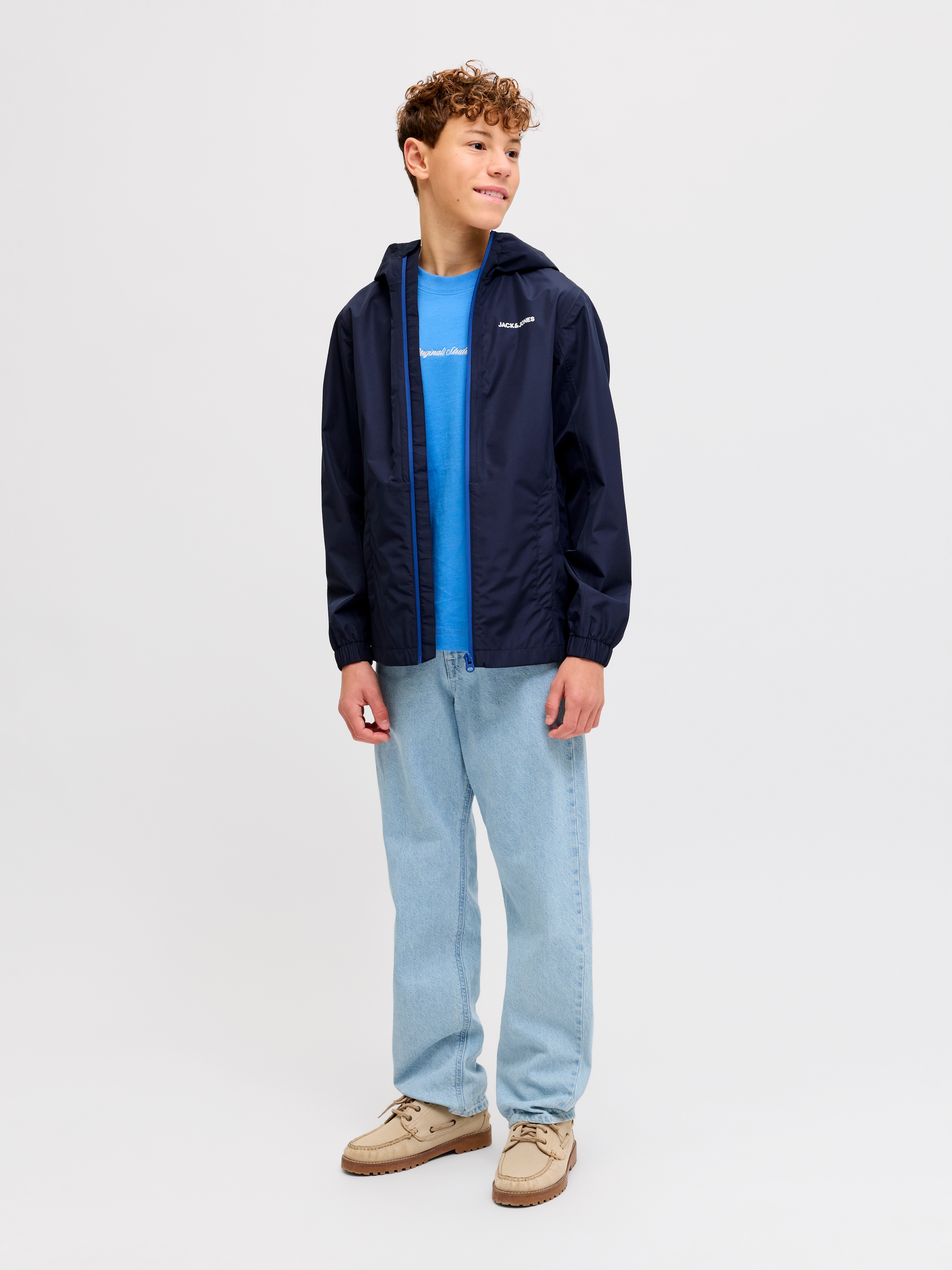 Jack & Jones Junior Regenjacke »JJEFLYNN RAIN JACKET SN JNR« mit Kapuze