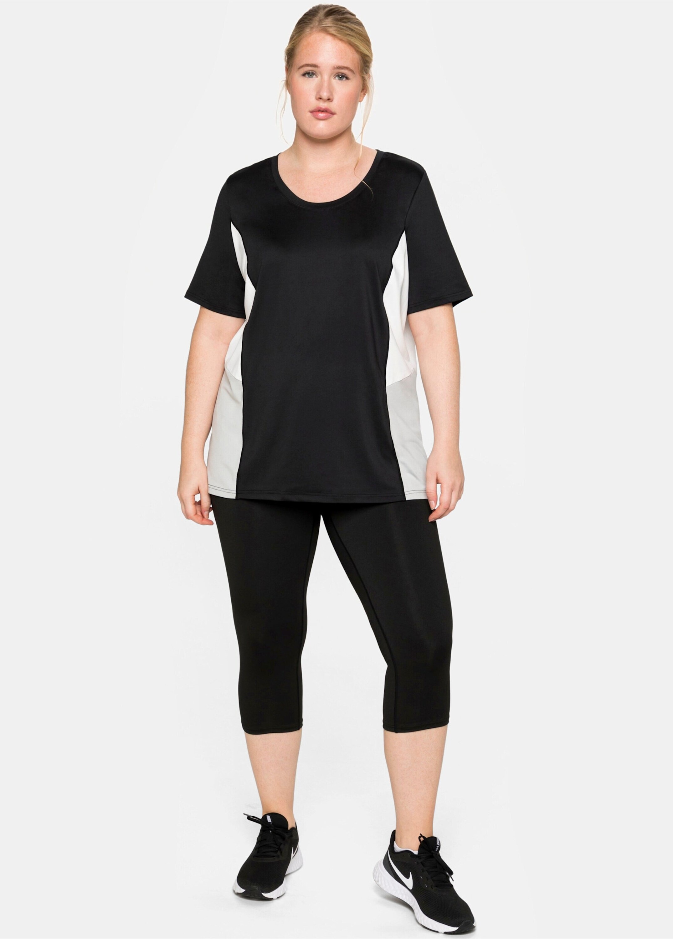 Sheego Schlupfhose »Sporthose Funktionstights in Caprilänge«  aus Funktionsqualität, mit Innentasche