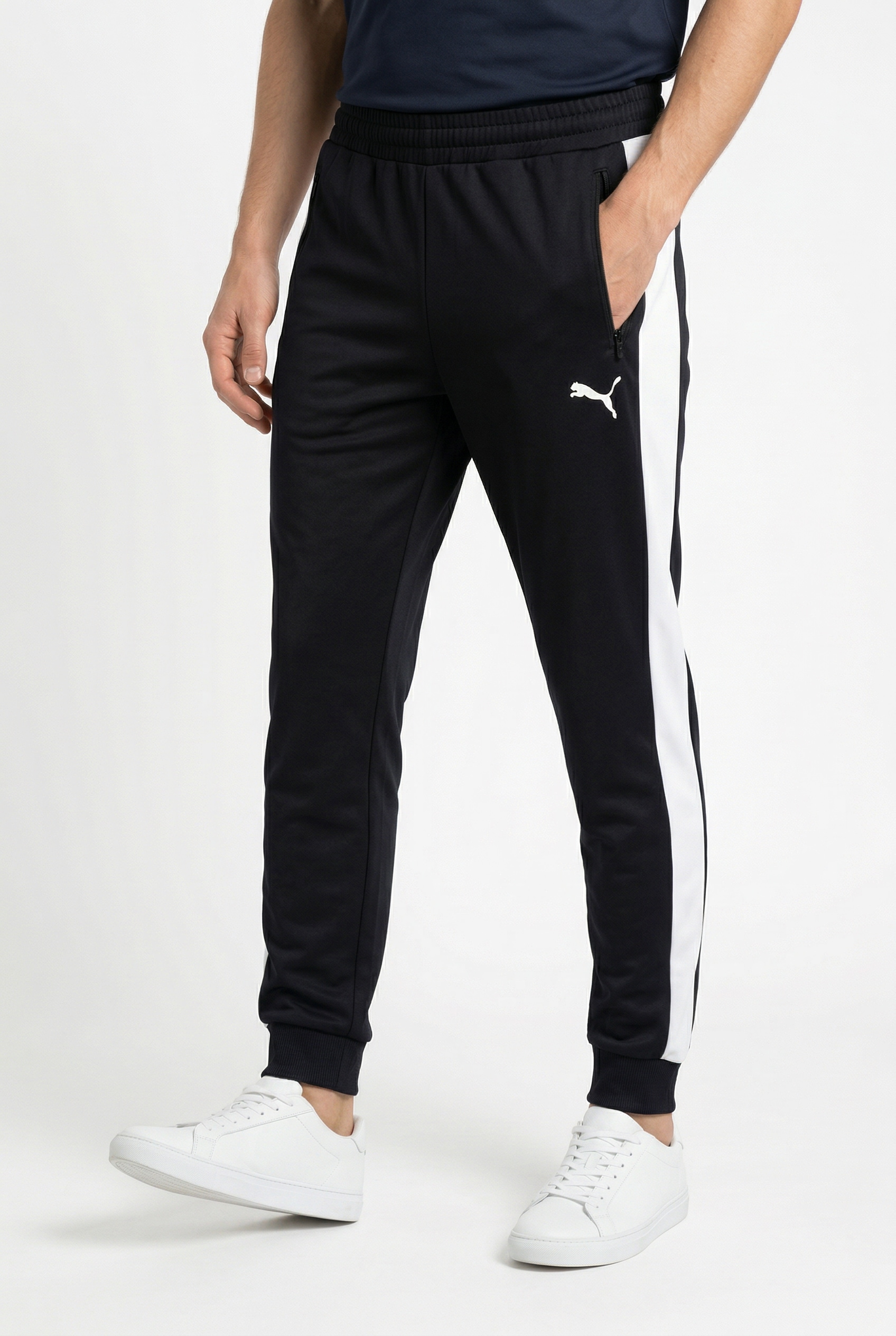 PUMA Trainingshose »T7 FOUNDATION CL POLY KNITTED PANTS«  mit Eingrifftaschen, Regular Fit, sportlicher Stil