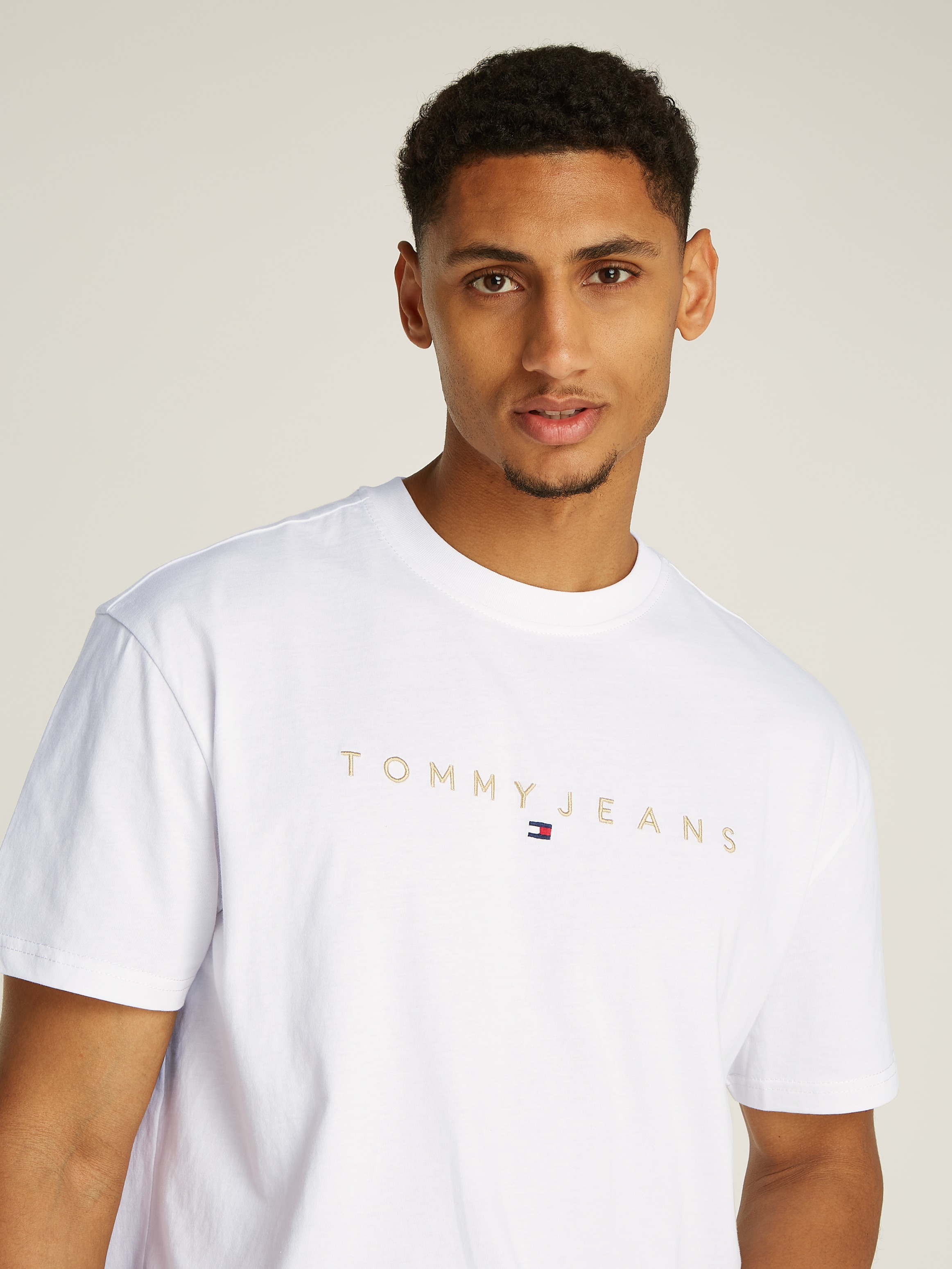 Tommy Jeans T-Shirt »TJM REG GOLD LINEAR LOGO TEE EXT«