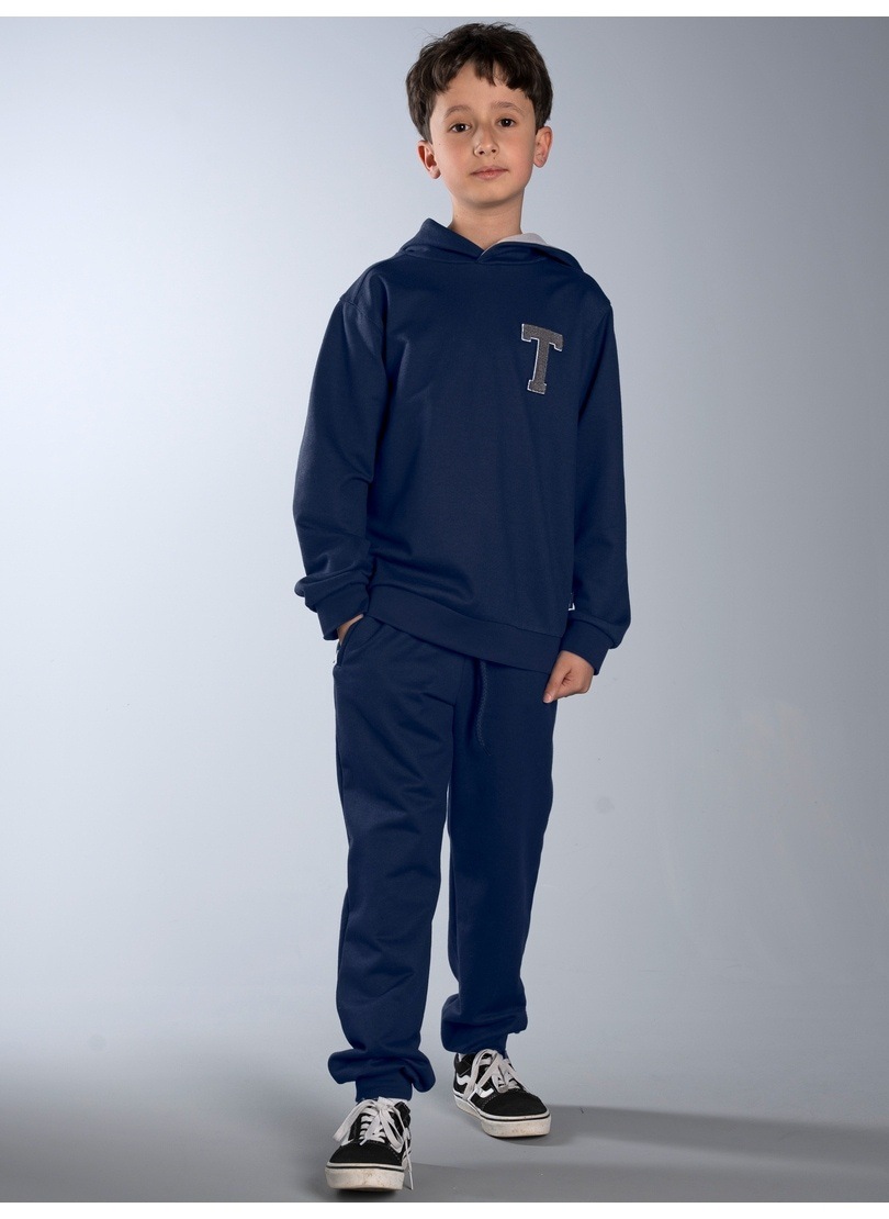 Trigema Loungeanzug »TRIGEMA Freizeitanzug mit trigema Moos-Patch« 1