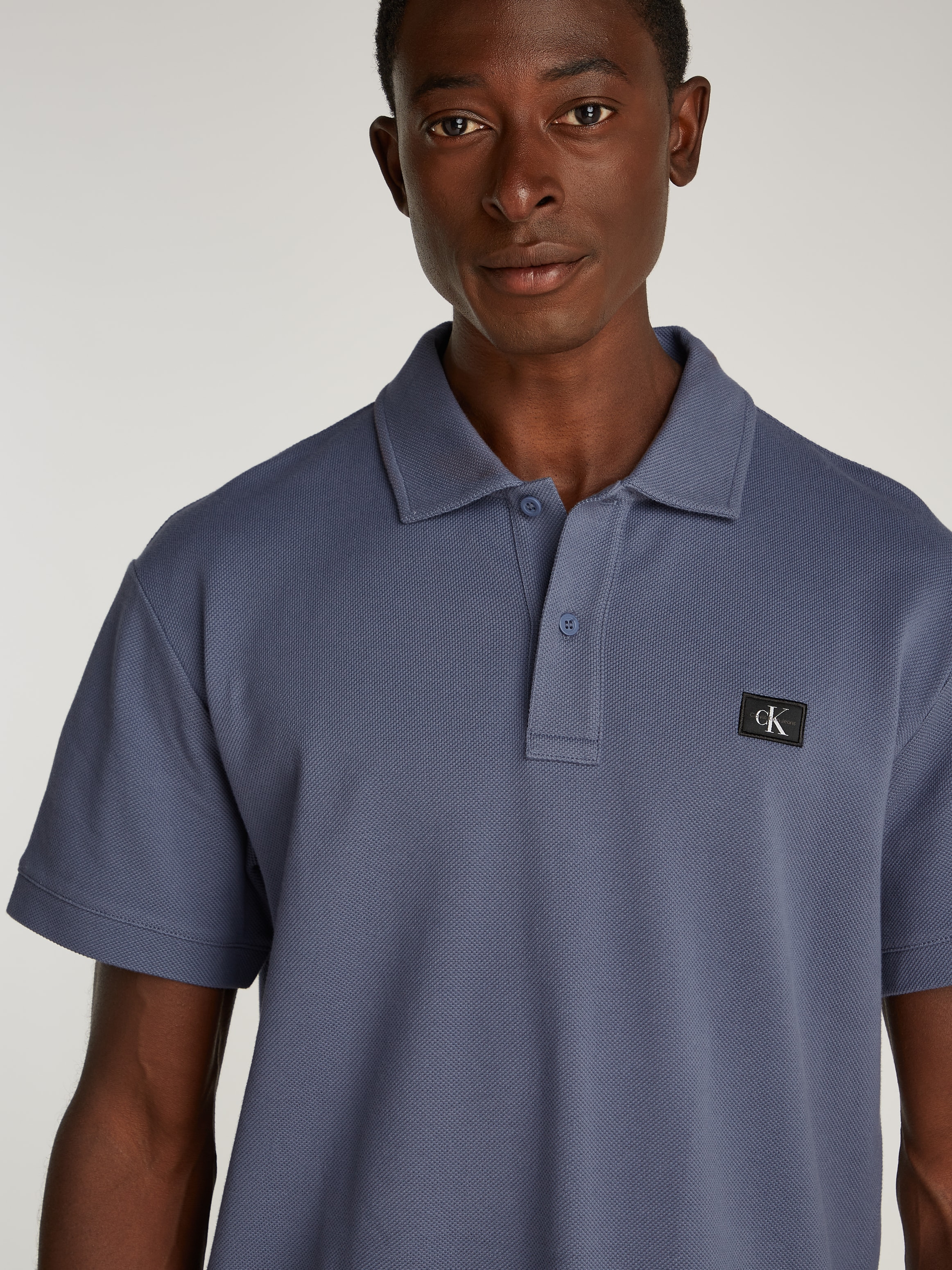 Calvin Klein Jeans Poloshirt »WOVEN LABEL POLO«, Logodruck