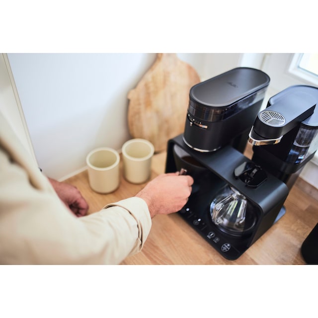 Melitta Kaffeemaschine mit Mahlwerk »EPOS® 1024-03 Schwarz/Silber  360°rotierender Wasserauslauf«, 1 l Kaffeekanne, Papierfilter, 1x4 jetzt  online bei OTTO