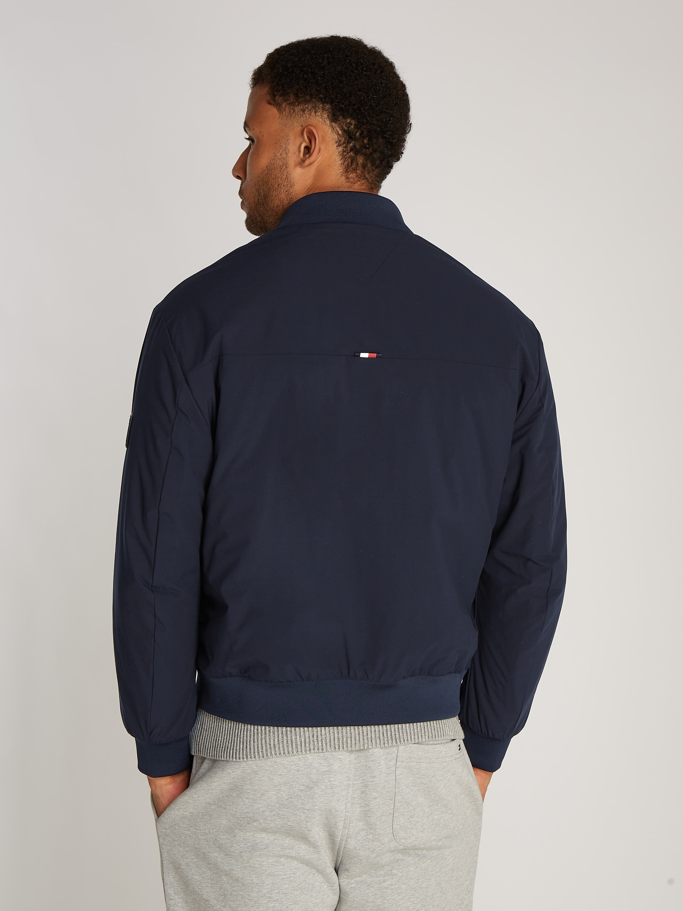 Tommy Hilfiger Bomberjacke »TECH BOMBER«, mit wasserabweisendem Reißverschluss