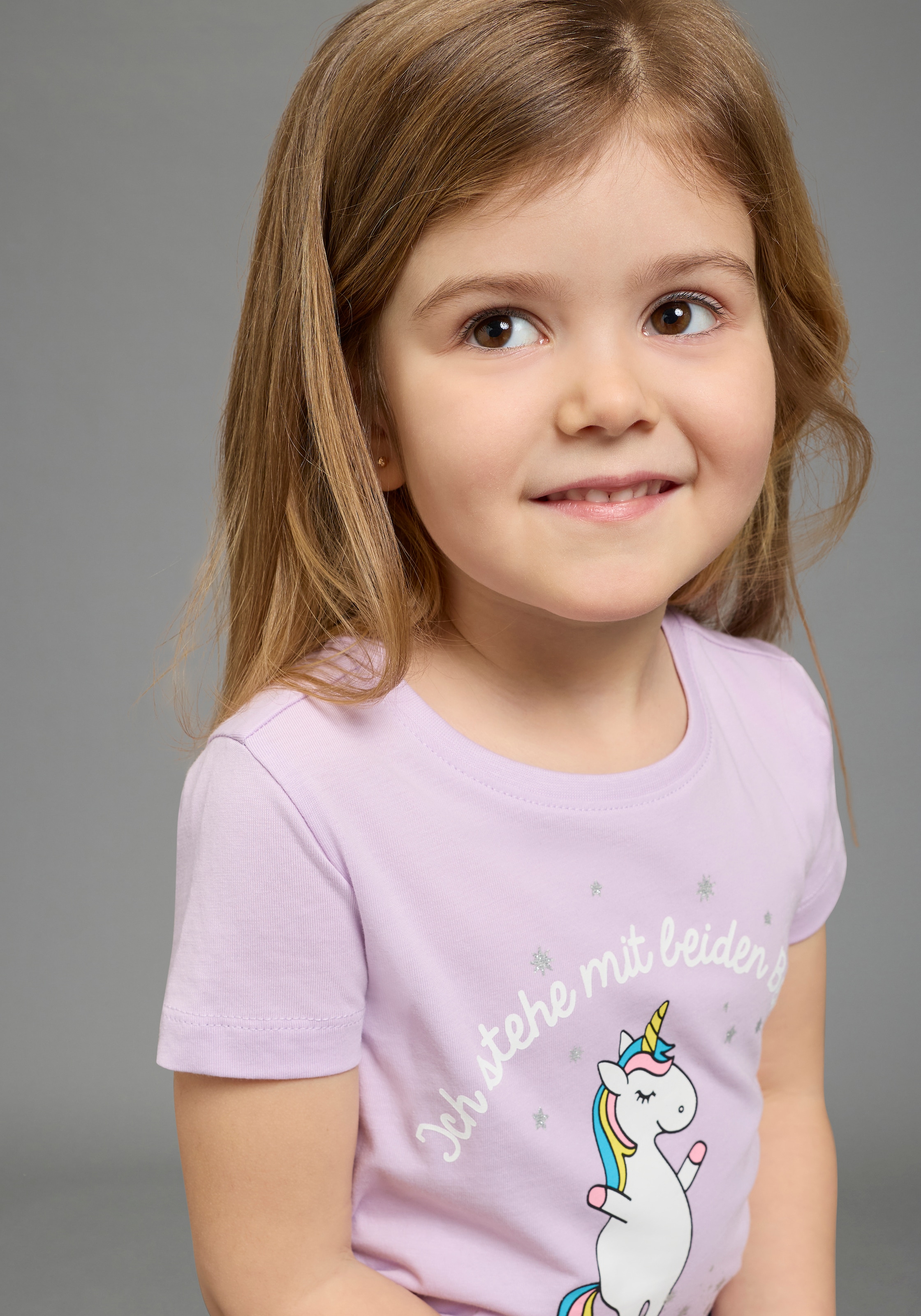 KIDSWORLD T-Shirt »Mit Einhorn-Druck und Glitzereffekten« mit stylischem Einhorn-Print