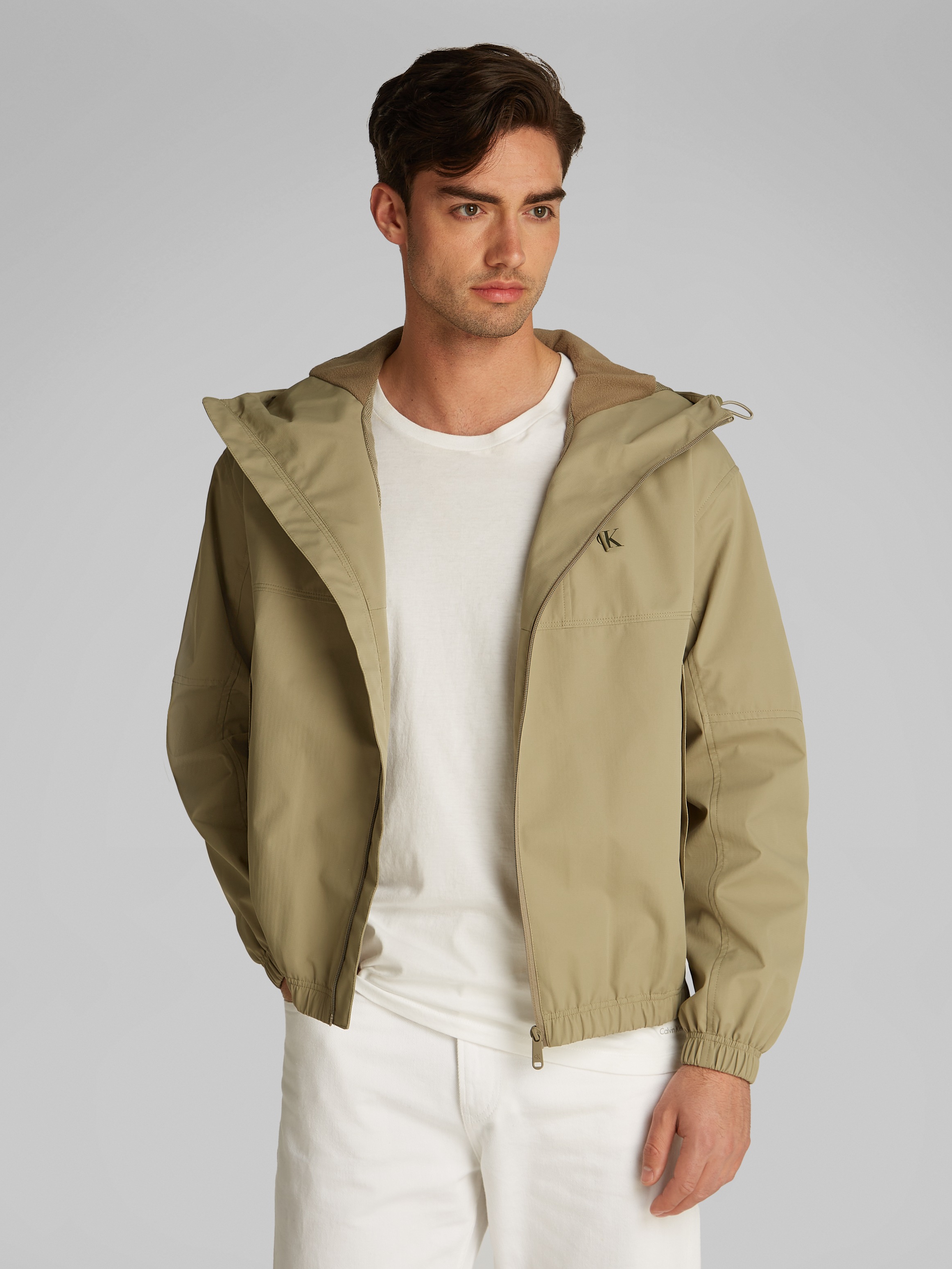 Calvin Klein Jeans Allwetterjacke »TECHNICAL JACKET«, mit Kapuze, Logodruck, Eingriffstaschen