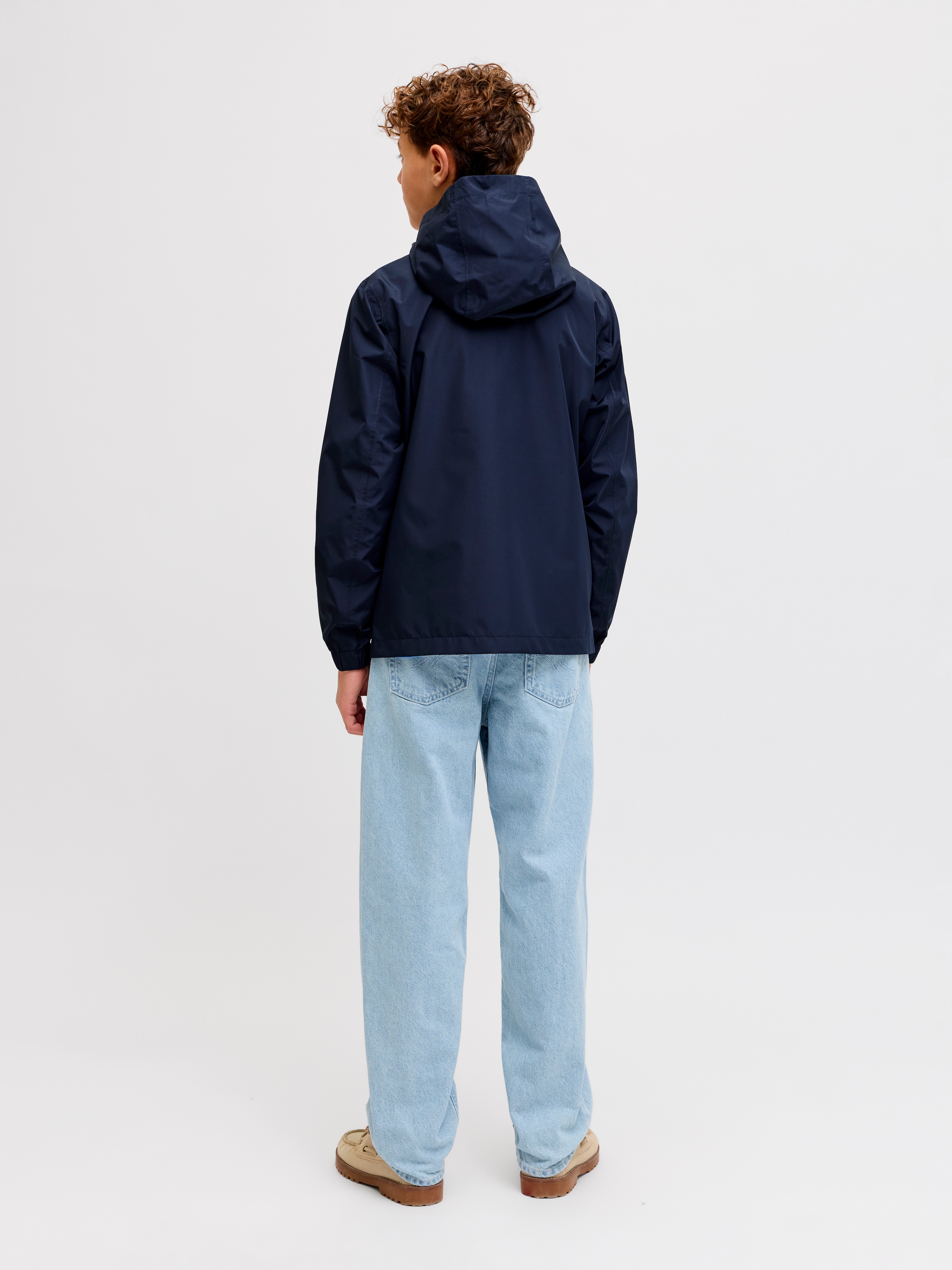 Jack & Jones Junior Regenjacke »JJEFLYNN RAIN JACKET SN JNR« mit Kapuze