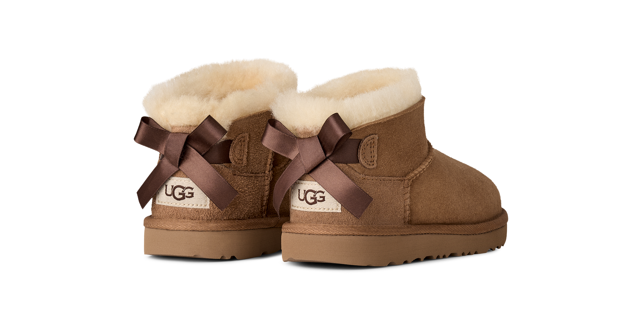 UGG Schlupfboots »K ULTRA MINI BAILEY BOW«  Winterboots mit kurzem Schaft und Ziernähten