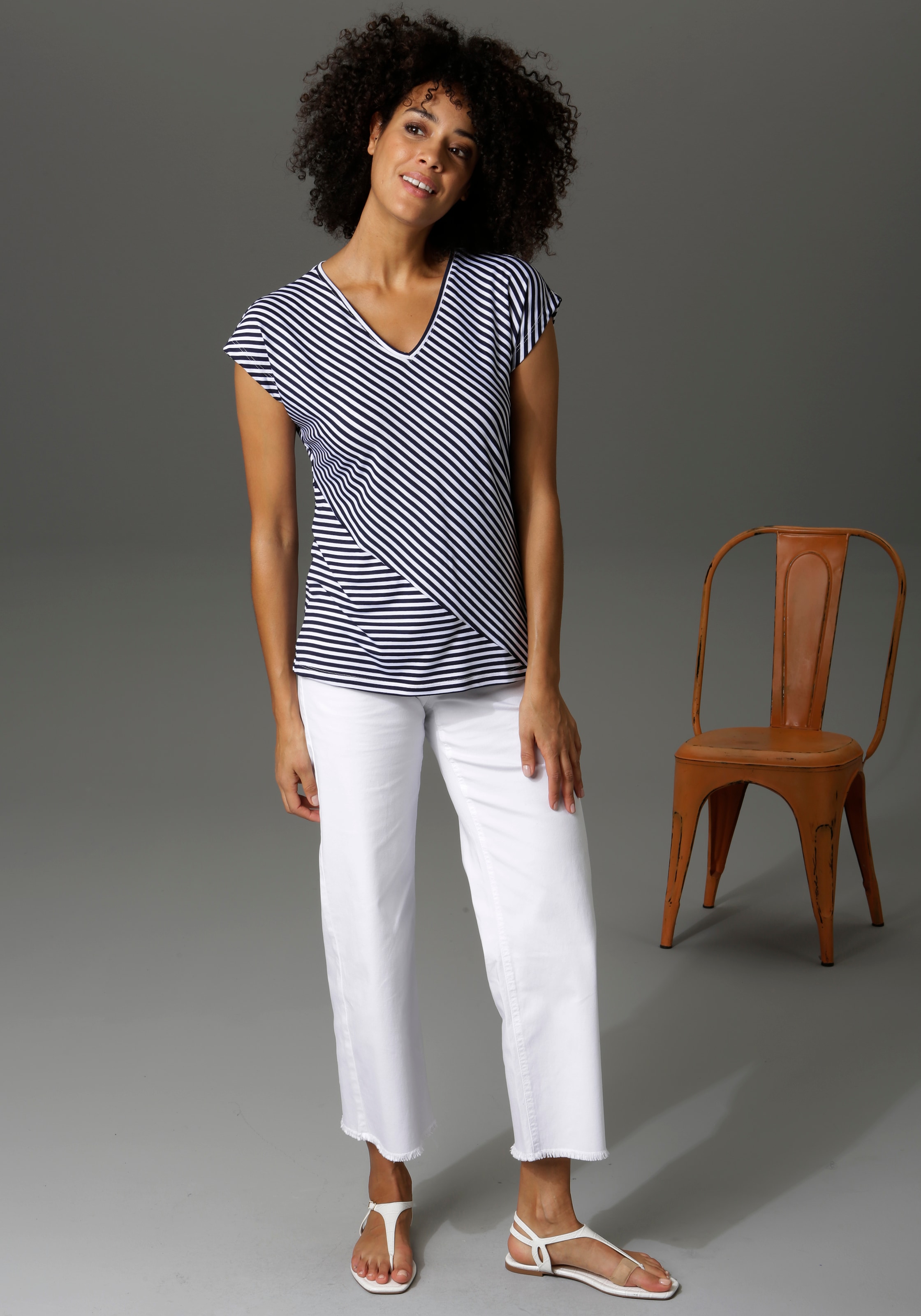Aniston CASUAL 7/8-Jeans, mit leicht ausgefranstem Beinabschluss