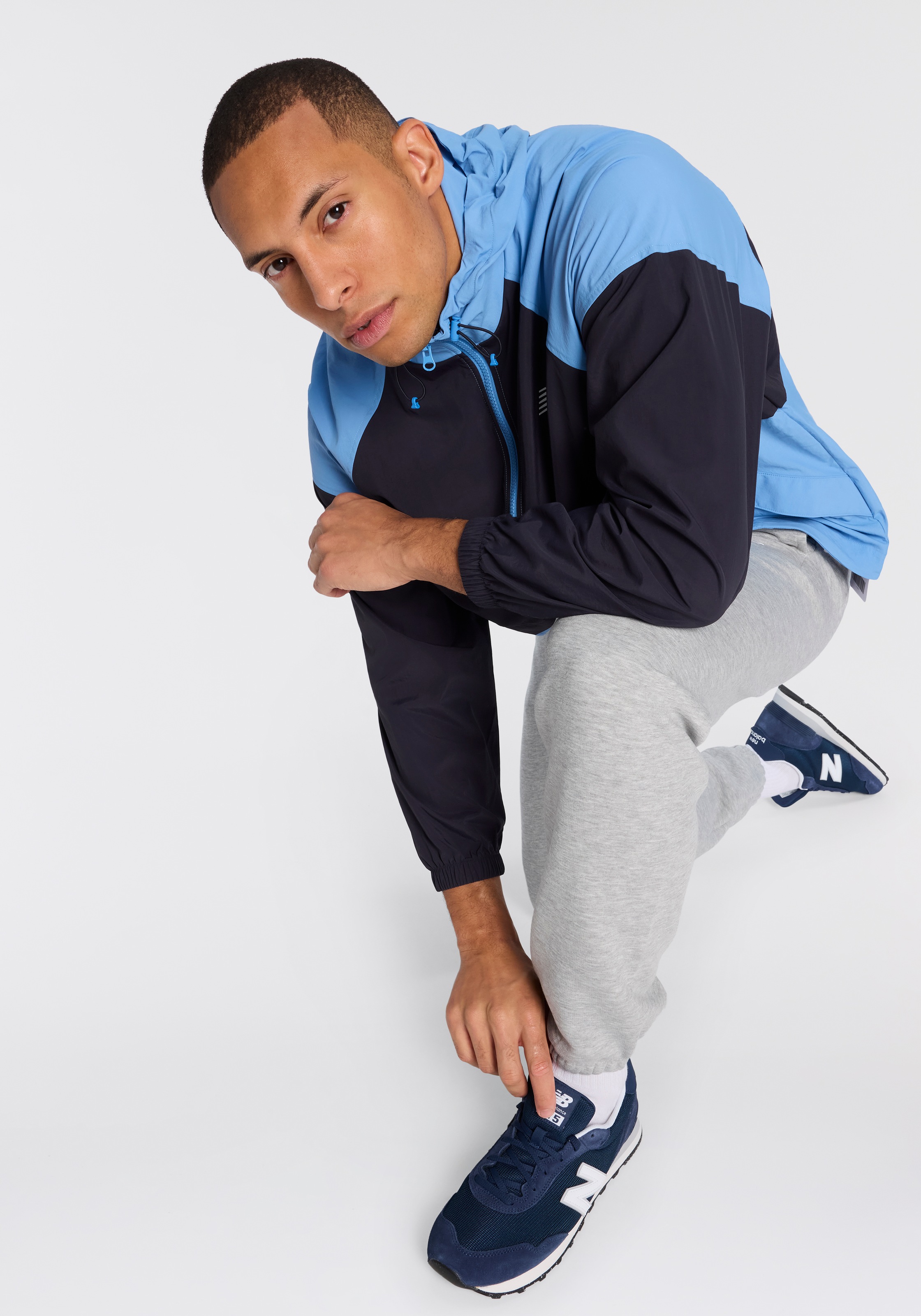 New Balance Windbreaker »SPORT ESSENTIALS FZ JACKET« mit Kapuze Oversized geschnittene Windjacke, wasserabweisend