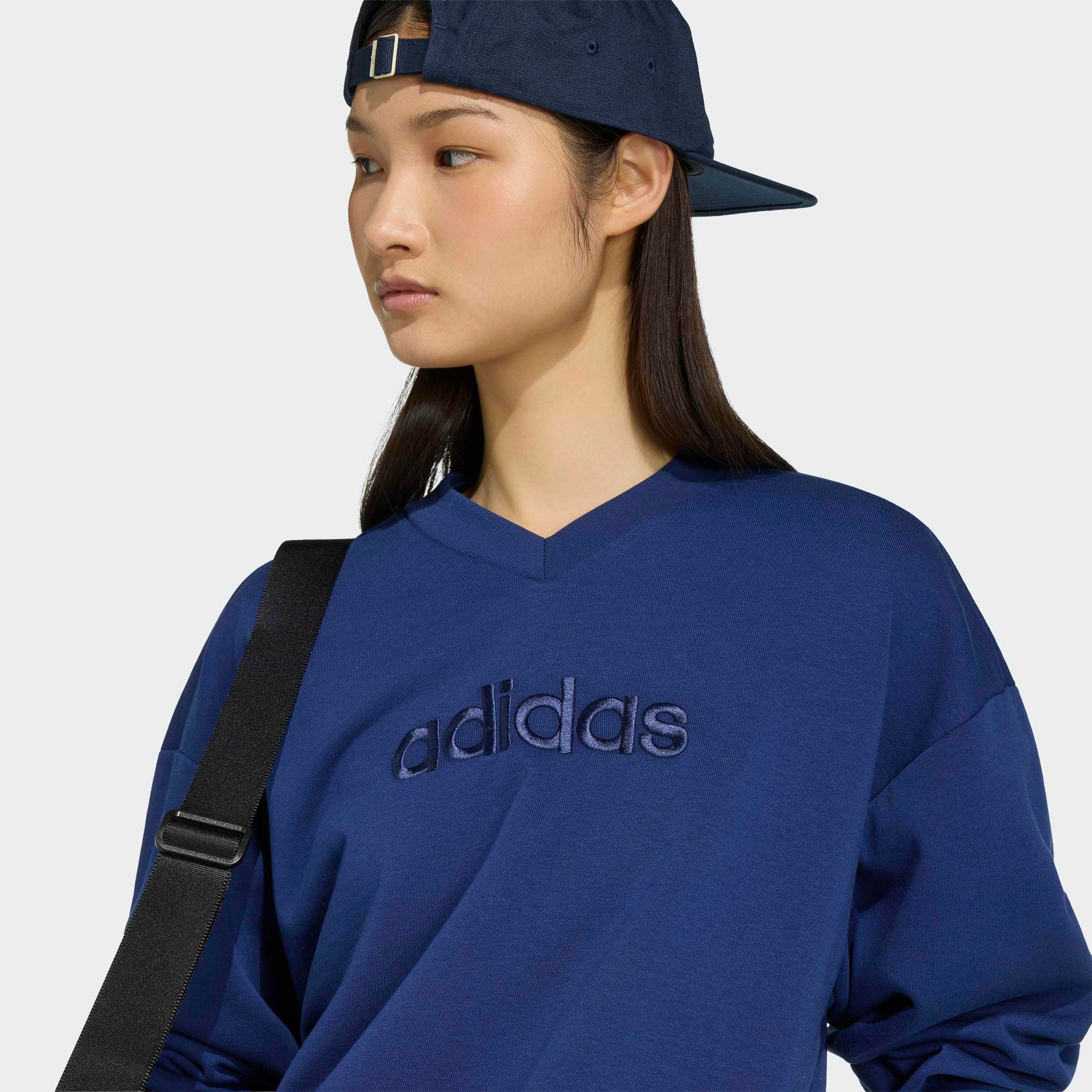 adidas Sportswear Sweatshirt »SEASONAL ESSENTIALS SATIN-, V-AUSSCHNITT«, mit V-Ausschnitt, ohne Verschluss, in normaler Länge
