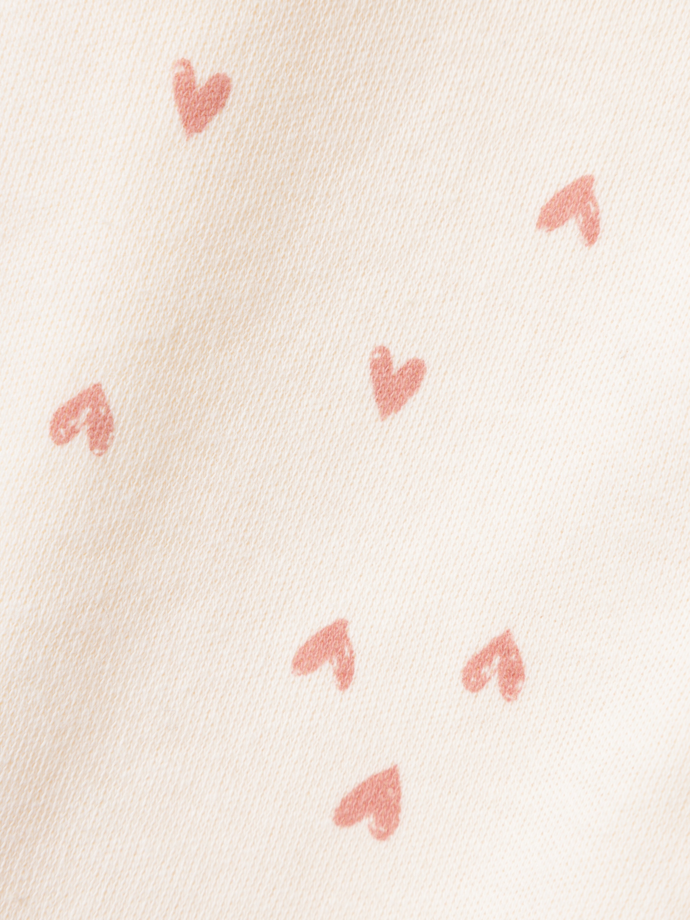 Name It Schlafanzug »NBFNIGHTSUIT ZIP BUTTERCREAM HEARTS NOOS« aus Baumwolle in Jersey-Qualität, Relaxed Fit, mit Reißverschluss