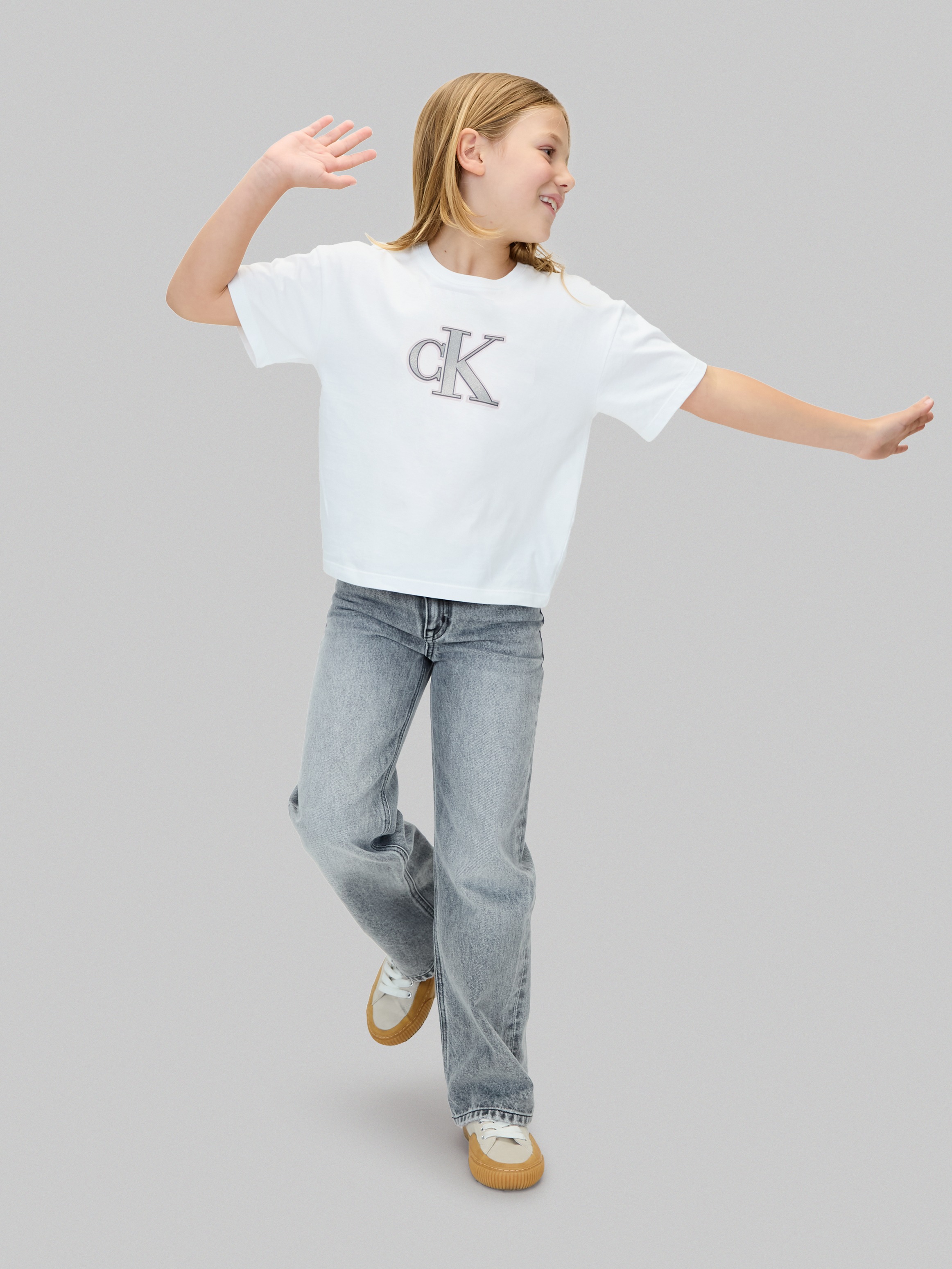 Calvin Klein Jeans T-Shirt »FESTIVE GRAPHIC SS T-SHIRT«, für Kinder bis 16 Jahre, Glitzer-Druck